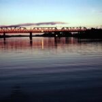 Image: bridge over river at sunset