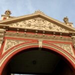 Image: ornate yellow and red archway from early 1900s