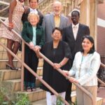 Image: group of people standing together on steps