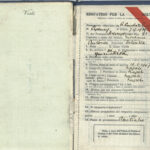 Image: open passport showing handwritten details