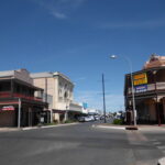 Image: A view down a main street of the town Kadina showing a pub to the rights, and other various buildings