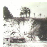 Image: Photo of a quarry with horse and carts and workmen