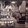 Image: large displays of artfully arranged crockery, vases, jam jars and other items fill a large hall.