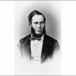 Image: Black and white portrait of a man with heavy sideburns