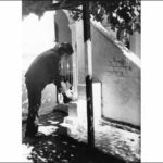 Image: Man removing his shoes for prayer