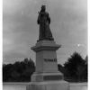 Image: statue of standing queen in royal robes and crown