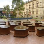 Image: sculpture of black stone with water