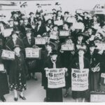 Image: group of women holding posters