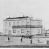 Image: pencil drawing of people in front of large stone building