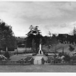 Image: walled garden with stone statue in middle