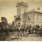 Image: gentry riders posing with their hounds