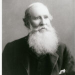 Image: Portrait of a man with a white beard and dark jacket