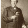 Image: A painted portrait of a middle-aged Caucasian man wearing a mid-19th century coat and bowtie. Three medals are pinned to the left breast of his coat