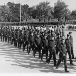 Image: men and women marching