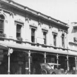 Image: Busy street scene with prominent building fronts