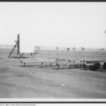 Image: Large white screen with benches in front of it