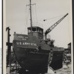 Image: Front view of a tug boat sitting in a yard in the process of being constructed