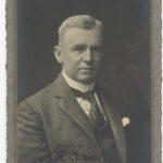 Image: portrait of man wearing tie and suit jacket