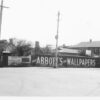 Image: view of a street corner with telephone box and poles