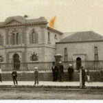 Image: people standing in front of buildings