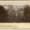 Image: crowds surrounding stone statue of standing man