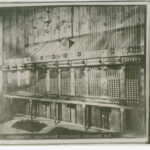 Image: Black and white photograph of a telephone exchange. There are no people present