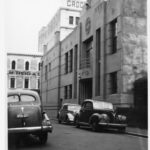 Image: view of cars parked in front of building