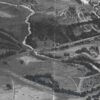 Image: map drawing of buildings, roads, river, bridge and tunnel