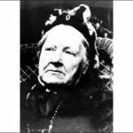 Image: Close up of elderly woman wearing bonnet style hat