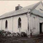 Image: black and white shot of simple, worn chapel