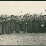 Image: black and white photo of group of men with musical instruments