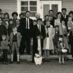 Image: large group of people in front of building