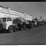 Image: large truck in front of stone building