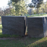 image: memorial of large granite stone split in two