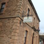 Image: Colour photo of a brick building with sign for the Gawler National Trust Museum.