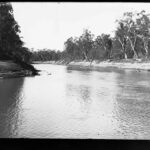 Image: River surrounded by land covered in trees