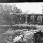 Image: bridge with river underneath it and irrigation works