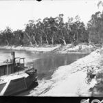 Image: Boat on land next to river Murray