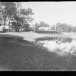 Image: buildings on edge of river, intended for boat landing purposes