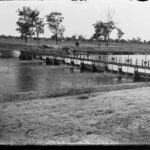 Image: Man on bridge over the river