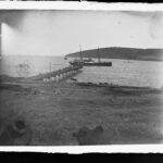 Image: boat in water near jetty on island