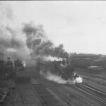 Image: steam train with large cloud of smoke