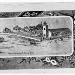 Image: A low, squat church building stands at the intersection of two dirt roads. People stand in front of the church