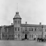 Image: large stone building with central tower like structure