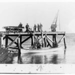 Image: men on a jetty