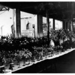 Image: long table covered with vases of flowers