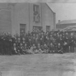 Image: A group of German Club members stand in a group at the front of the German Club