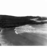 Image:View of high cliffs with the sea and beach below