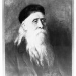 Image: A painted head-and-shoulders portrait of an elderly Caucasian man with a long white beard and equally long hair. He is wearing what appear to be ecclesiastical vestments and a hat