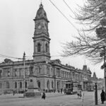 Image: Black and white photo of a clock tower and building, 27 September 1928.